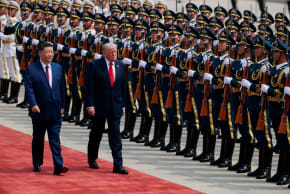 US President Donald Trump inspects an honour guard during a welcome ceremony with Chinese President Xi Jinping at the Great Hall of the People in Beijing, China, May 14, 2026.