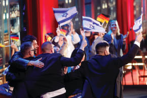 NOAM BETTAN and the Israeli delegation celebrate after qualifying for the Grand final during the first semi-final of the 2026 Eurovision Song Contest, in Vienna, on Tuesday. (