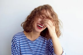 A woman laughing 