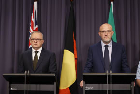 DIRECTOR-GENERAL of Security of ASIO Mike Burgess (R) and Prime Minister Anthony Albanese (L) speak to the media at Parliament House on December 14, 2025 in Canberra, Australia. 
