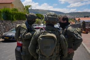 Israeli security forces at the scene where a house was hit by an explosive drone launched by Hezbollah from Lebanon in Metula near the Israeli-Lebanese border, May 25, 2026.