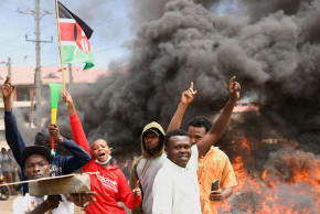 Demonstrators gather near a barricade they created during a protest against a U.S.-backed Ebola quarantine plan on the establishment of a 50-bed facility at a Kenyan air force base that was intended to host Americans exposed to Ebola, in Nanyuki town, in Laikipia County, Kenya June 1, 2026.