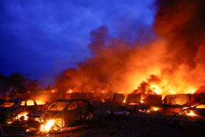 Cars and private garages of residents burn after Russian missile and drone strikes, amid Russia's attack on Ukraine, in Kyiv, Ukraine, July 6, 2026.