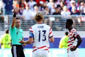Folarin Balogun of the US is shown a red card by referee Raphael Claus on July 1, 2026.