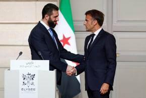 French President Emmanuel Macron shakes hands with Syrian President Ahmed al-Sharaa after a joint press conference after a meeting at the Elysee Palace in Paris, France, May 7, 2025. 