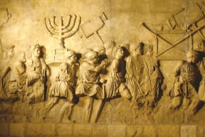 MODERN REPLICA of the Arch of Titus relief depicting the spoils of the Second Temple, carried in a triumphal procession through Rome following its conquest of Jerusalem in 70 CE.