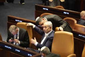 Prime Minister Benjamin Netanyahu and Communications Minister Shlomo Karhi are seen in the Knesset plenum during a vote on the minister's communications reform, in Jerusalem, July 16, 2026