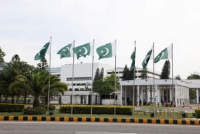 Pakistani flags flutter near the Parliament House, as delegations from the United States and Iran are expected to hold peace talks, in Islamabad, Pakistan, April 11, 2026.