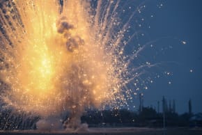 Unexploded ordinance, an artillery shell containing white phosphorous, is detonate