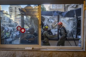 Police and emergency personnel at the scene where a balcony collapsed onto a bakery, leaving one person dead and several others injured, in Jerusalem, July 20, 2026. 