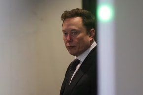 Elon Musk walks to attend the trial in his lawsuit over OpenAI for-profit conversion at a federal courthouse, in Oakland, California, US, April 29, 2026.