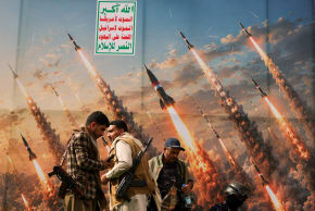Houthi activists stand on a platform against a banner depicting Houthi missiles, at an anti-Saudi rally amid an escalation with the kingdom, in Sanaa, Yemen, July 31, 2026. 