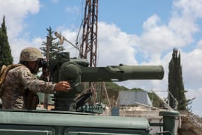 A member of the Lebanese army sits on a military vehicle in Zawtar al-Gharbiyeh, after the withdrawal of Israeli forces under a US-mediated plan, in southern Lebanon, July 26, 2026. 