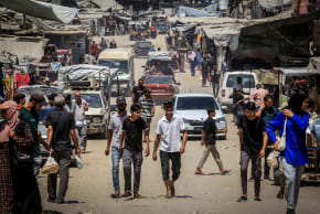 Palestinians are seen walking in Khan Yunis, southern Gaza Strip, August 12, 2026