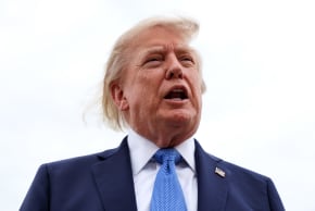 US President Donald Trump speaks to reporters before boarding Air Force One on August 14, 2026 at Joint Base Andrews, Maryland.