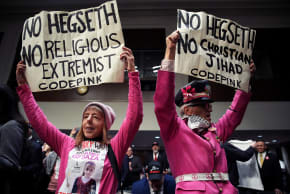 rotesters with the group CodePink demonstrate at the start of the Senate Armed Services confirmation hearing for President-elect Donald Trump's nominee for Secretary of Defense Pete Hegseth on Capitol Hill on January 14, 2025 in Washington, DC.