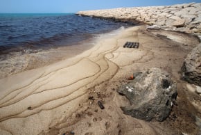 This photograph obtained from Iran's ISNA news agency on August 13, 2026 shows an oil slick along the southern coast of Qeshm Island, Iran, August 13, 2026. 