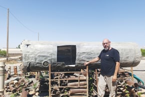 YARON BOB stands next to a remnant of an Iranian ballistic missile in the backyard of his blacksmith studio in Yated. 