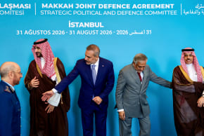 Turkey's Foreign Minister Hakan Fidan, Pakistan's Deputy Prime Minister and Foreign Minister Mohammad Ishaq Dar, and Saudi Arabia's Foreign Minister Prince Faisal bin Farhan Al Saud prepare to pose for a picture before the first committee meeting under the Mecca Joint Defense Agreement.
