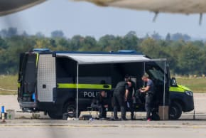 (Illustrative) Police officers work in the vicinity of an Antonov cargo plane, near which a drone was found, at Leipzig/Halle Airport in Schkeuditz, Germany, August 5, 2026, after the police said explosives experts examined a drone near a runway.