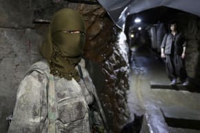 A member of the Kurdistan Free Life Party, known as PJAK, stands inside a tunnel at a site near the Iraqi border with Iran, on the outskirts of Penjwen, in Iraq’s autonomous Kurdistan region, Iraq, March 24, 2026. 