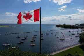 A Canadian flag flies along the waterfront of Lake Ontario, in Toronto, Canada, in August.