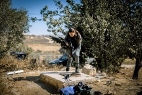 A police officer at the entrance to a tunnel in the West Bank.