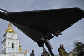 People look at an Iranian-designed HESA Shahed 136 (Geran-2) drone at an open-air exhibition of destroyed Russian military equipment on Mykhailivska Square in front of Saint Michael's Golden-Domed Cathedral, in Kyiv, on April 7, 2026.