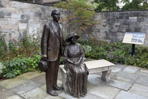 Statues of Henry and Clara Ford look over the garden at their historic Fair Lane home in Dearborn, Michigan, Sept. 2, 2026.