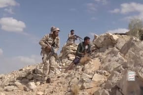 Iran-aligned Houthi fighters occupy a firing position in a screengrab from a video said to show Houthi fighters attacking Saudi-backed forces in the location given by the source as al Jawf governorate, Yemen.