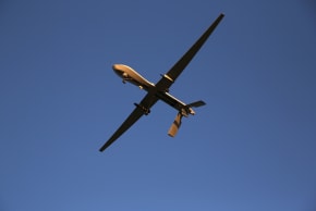 A US Air Force MQ-1B Predator unmanned aerial vehicle (UAV), carrying a Hellfire missile flies over an air base after flying a mission in the Persian Gulf region on January 7, 2016; Illustrative.