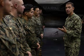 US Navy Admiral Brad Cooper, commander of US CENTCOM, speaks with crew members of the America-class amphibious assault ship USS Tripoli, deployed to the US 5th Fleet area of operations to support maritime security in the Middle East, in this handout photo released May 3, 2026. 