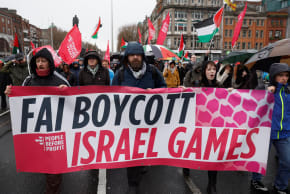 Demonstrators hold a banner urging the Football Association of Ireland (FAI) to boycott upcoming UEFA fixtures with Israel, in support of Palestinians during a protest in relation to the ceasefire in Gaza, in Dublin, Ireland, February 21, 2026. 