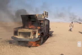 Iran-aligned Houthi fighters move next to a destroyed vehicle following what the source described as an attack on Saudi-backed forces in the location given by the source as al Jawf governorate, Yemen, in this screengrab taken from a video released by Houthi Military Media on September 15, 2026.