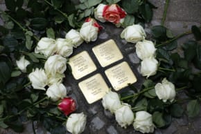 Roses are laid at Stolpersteine (stumbling stones) commemorating relatives of Israeli ambassador to Germany Ron Prosor, Elfriede, Berthold, Liselotte and Ulrich Proskauer during a Stolpersteine laying ceremony in Berlin on September 23, 2024. 