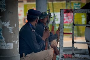 Pakistani police officers keeping security in a public area. Ilustrative.