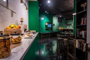THE JOSEPH’S floor is black marble, and the walls are painted green, giving an interesting color contrast.