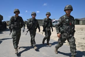 South Korean Marines walk across a training area during a Combined Joint Logistics Over-the-Shore (CJLOTS) and Combat Service Support Area (CSSA) operations as part of a joint field training exercise conducted by South Korea-US Combined Forces Command in Pohang on July 15, 2026. 