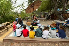 Jewish children are seen around a shofar.
