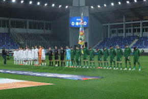 Israel's players (L) and the Republic of Ireland's players (R) stand alongside the officials for the national anthems ahead of the UEFA Nations League Group B3 football match between the Republic of Ireland and Israel at the TSC Arena in Backa Topola on October 4, 2026.