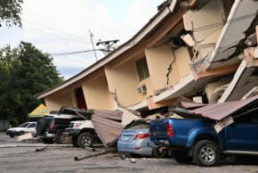 This view shows a collapsed building and damaged cars after a 7.6-magnitude earthquake struck the country, in Penonome, Panama, on October 9, 2026. 