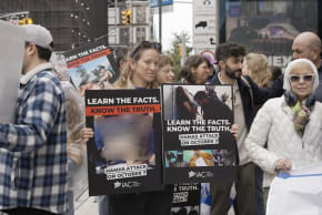 Pro-Israel activists hold signs highlighting the October 7 Hamas attacks during an Israeli American Council (IAC) protest against screenings of the documentary NAZA in the US.