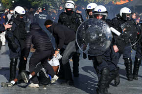 Police detain a demonstrator during a students' protest in Brussels, Belgium, October 17, 2026.