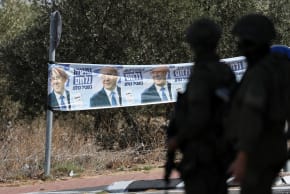A banner featuring Prime Minister Benjamin Netanyahu is displayed near Palestinian-owned olive groves in the village of Rantes near Ramallah, in the West Bank, October 6, 2026
