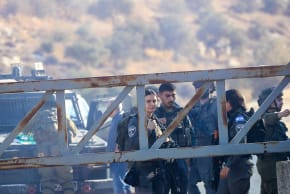 Israeli military forces fire tear gas and disperse Palestinian farmers, preventing them from continuing the olive harvest as they attempt to cross an iron gate erected by the Israeli army in the village of Salem, east of Nablus in the West Bank, October 17, 2026.