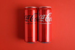 Cans of drink Coca Cola classic and Coca Cola zero.
