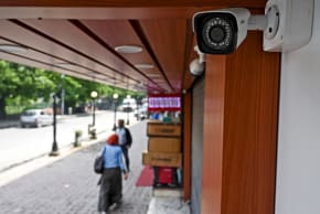 This picture taken on May 5, 2022, shows a CCTV camera installed outside a shop at a market in Srinagar. India has ordered all private businesses in Indian-administered Kashmir to install security cameras.