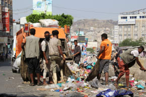 Workers collect garbage from a street in the southwestern city of Taiz, Yemen, October 20, 2026.