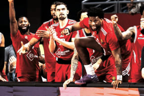 Hapoel Tel Aviv players celebrate on the bench during their 90-81 comeback Euroleague victory over Virtus Bologna in Bulgaria.