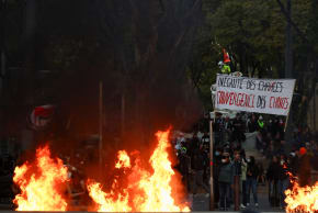 A fire burns next to a sign reading "Inequality of opportunity" during an authorised demonstration organised by a labour union in Marseille, France, October 24, 2026